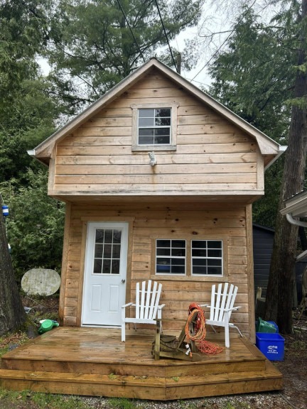 Cabin before — natural wood siding