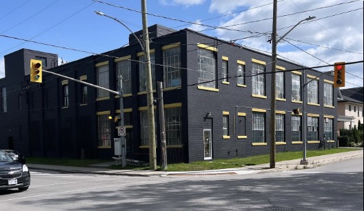 Commercial building after — black with gold accents
