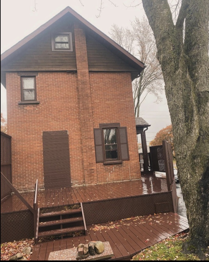 Deck after — rich dark brown stain
