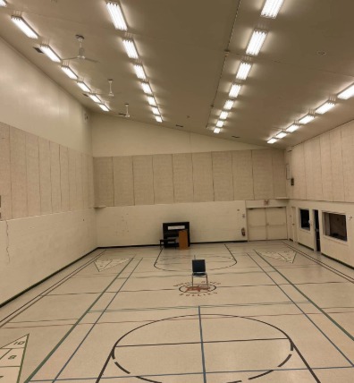 Gymnasium before — plain beige walls