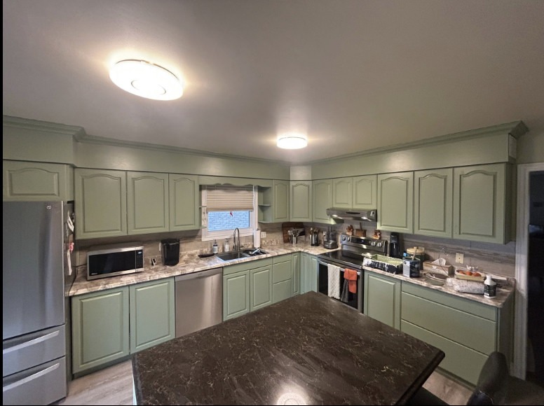 Kitchen cabinets after — sage green