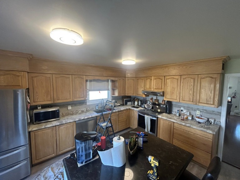 Kitchen cabinets before — natural oak
