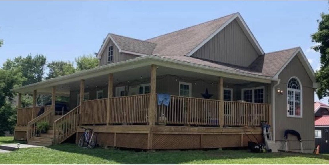 Porch railing before — natural wood